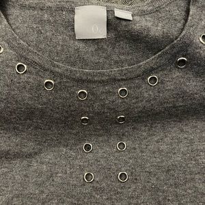 Gray, short-sleeve sweater shirt with metal eyelet details. Brand is 0 degrees C